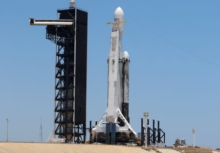 A SpaceX Falcon Heavy rocket, carrying the U.S. Air Force's Space Test Program-2 mission, is shown during launch preparation at the Kennedy Space Center in Cape Canaveral