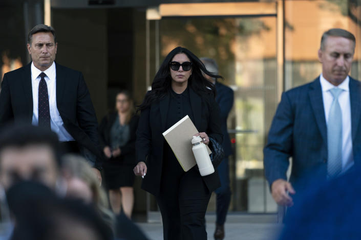 Vanessa Bryant, center, the widow of Kobe Bryant, leaves a federal courthouse in Los Angeles, Wednesday, Aug. 10, 2022. Kobe Bryant's widow is taking her lawsuit against the Los Angeles County sheriff's and fire departments to a federal jury, seeking compensation for photos deputies shared of the remains of the NBA star, his daughter and seven others killed in a helicopter crash in 2020. (AP Photo/Jae C. Hong)