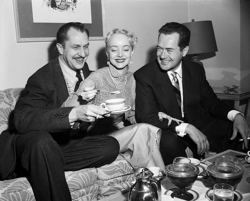 April 14, 1953: Stars of the 3-D shocker, “House of Wax”, enjoyed morning coffee in Fort Worth before personal appearances at the Worth Theater with the movie. Carolyn Jones sweetens up the coffee for Vincent Price, left, and Frank Lovejoy. Fort Worth Star-Telegram archives/UT Arlington Special Collections