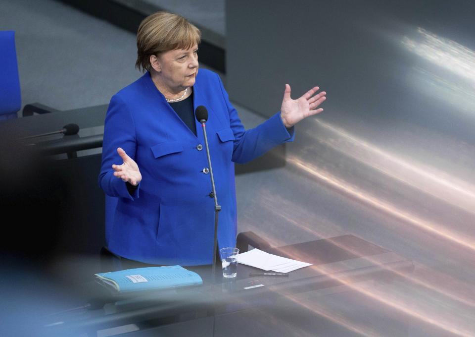 German Chancellor Angela Merkel (CDU) takes part in the government survey in the Bundestag in Berlin, Germany, Wednesday, May 13, 2020. The agenda of the 159th session of the German Bundestag includes the government survey as well as deliberations on foreign missions of the Bundeswehr. (Kay Nietfeld/dpa via AP)