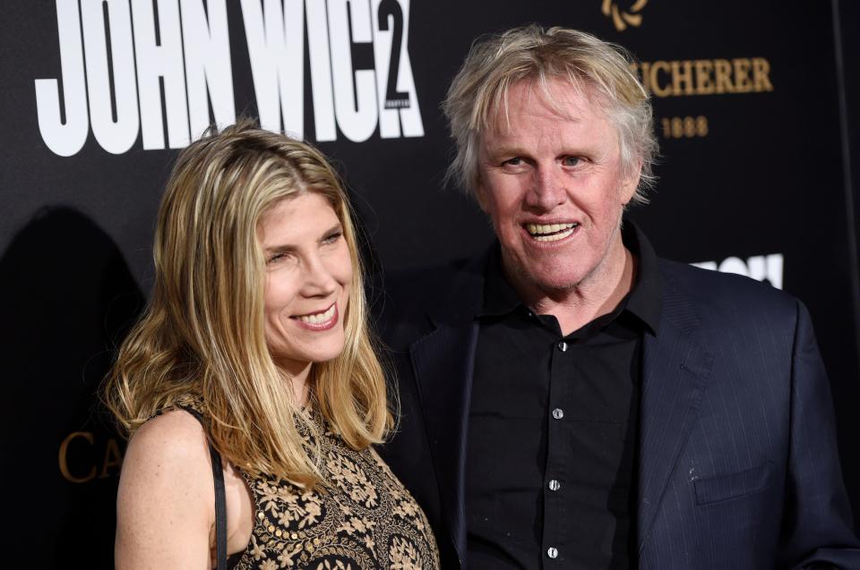 Actor Gary Busey and Steffanie Sampson pose together at the premiere of the film "John Wick: Chapter 2," on Jan. 30, 2017, in Los Angeles.