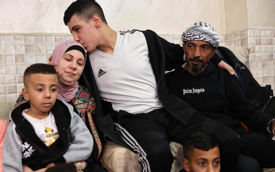 Israel's youngest prisoner Ahmad Salaima, 14, is welcomed by his family upon his arrival at his home in Israeli-annexed East Jerusalem.