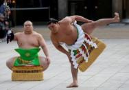 Mongolian-born grand sumo champion Yokozuna Harumafuji (R) performs the New Year's ring-entering rite at the annual celebration for the New Year at Meiji Shrine in Tokyo, Japan January 6, 2017. REUTERS/Issei Kato