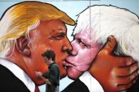 A mural of Donald Trump embracing Boris Johnson is seen on a building in Bristol, Britain May 24, 2016. REUTERS/Peter Nicholls