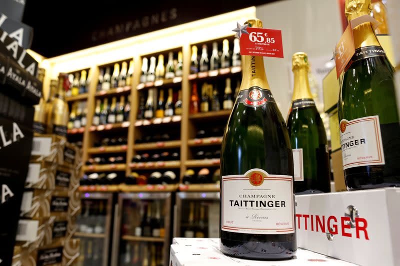 FILE PHOTO: Bottles of champagne are displayed at a Nicolas French wine specialist store in Paris