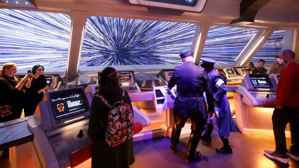 Guests enjoy one of the hotel's interactive scenes, featuring Disney cast members. - Allen J. Schaben/Los Angeles Times/Getty Images