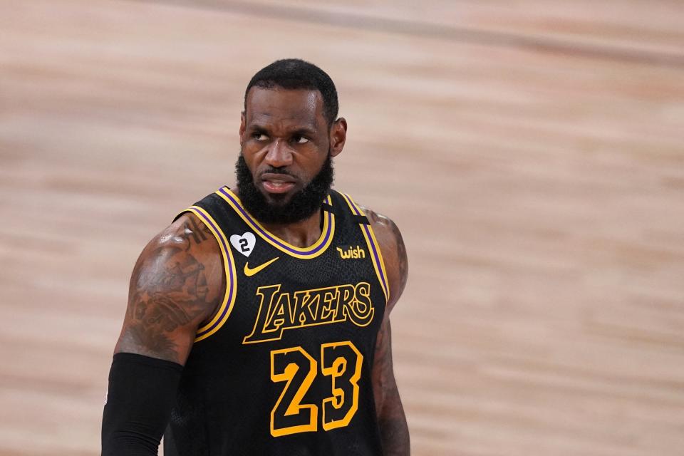 Los Angeles Lakers' LeBron James walks up court during the first half of Game 2 of basketball's NBA Finals against the Miami Heat on Friday, Oct. 2, 2020, in Lake Buena Vista, Fla. (AP Photo/Mark J. Terrill)