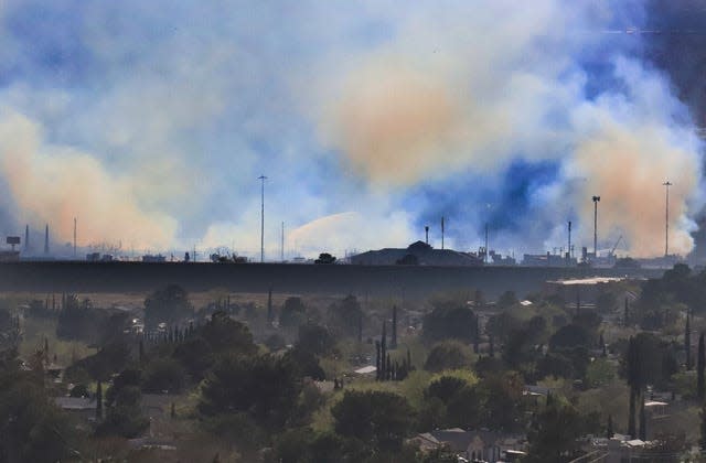 Smoke from a brush fire is seen Monday afternoon over the Upper Valley near Doniphan and Crossroads drives, where 19 units carrying 50 firefighters were dispatched to battle a brush fire. Firefighters kept the blaze from spreading.