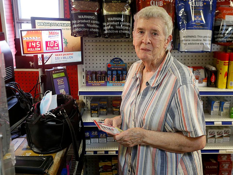 Joyce Telakowicz buys her lottery tickets at Troy Road Market on Wednesday, July 27, 2022. TOM E. PUSKAR/ASHLAND TIMES-GAZETTE