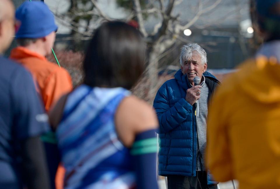 Frank Shorter, a 1972 Olympic marathon gold medal winner, speaks to the early start runners just before they started their runs at last year's Hyannis Marathon.