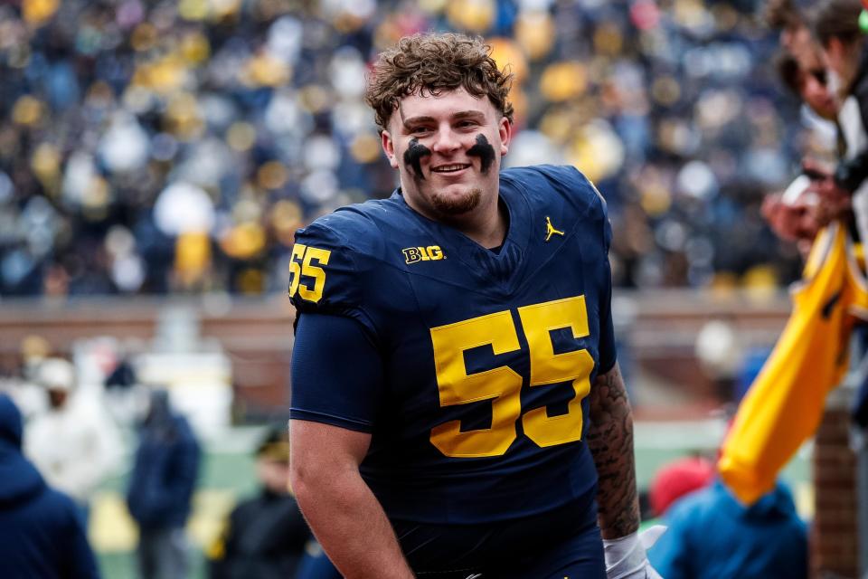 Blue Team defensive lineman Mason Graham (55) walks up the tunnel for halftime during the spring game at Michigan Stadium in Ann Arbor on Saturday, April 20, 2024.