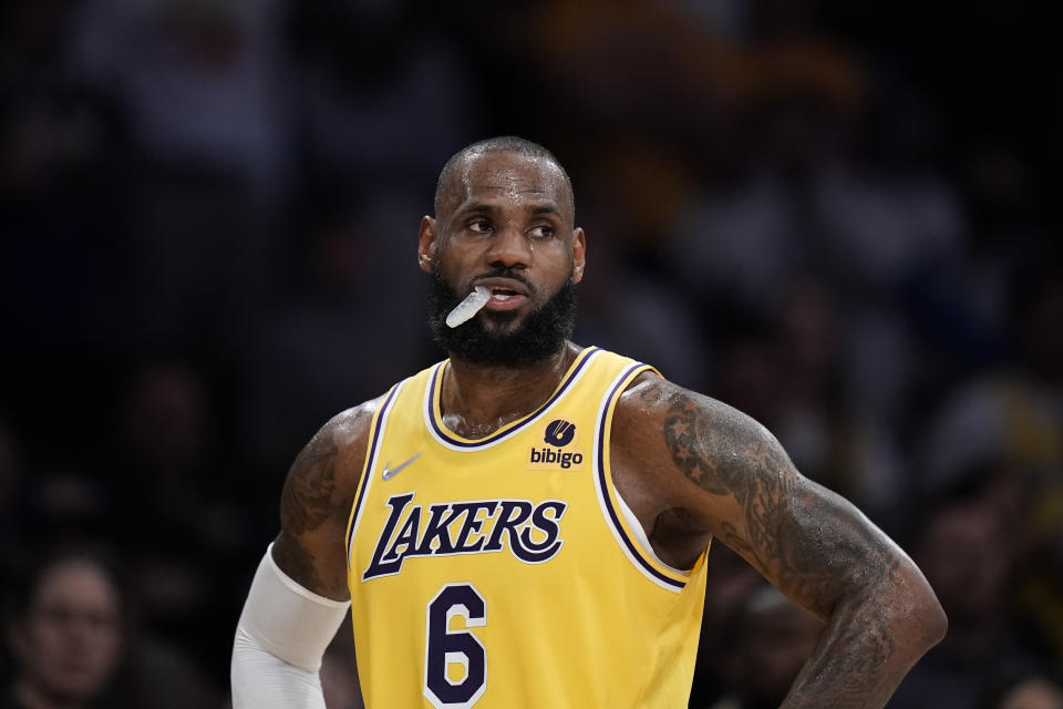 Los Angeles Lakers' LeBron James stands on the court during second half of an NBA basketball game against the Toronto Raptors Monday, March 14, 2022, in Los Angeles. (AP Photo/Jae C. Hong)