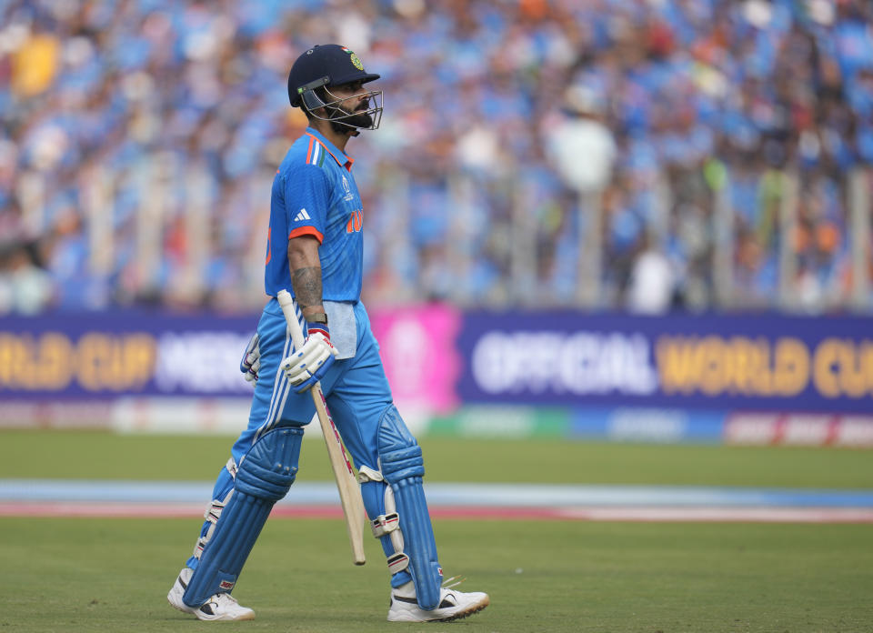 India's Virat Kohli leaves the ground after losing his wicket during the ICC Men's Cricket World Cup final match between India and Australia in Ahmedabad, India, Sunday, Nov.19, 2023. (AP Photo/Aijaz Rahi)