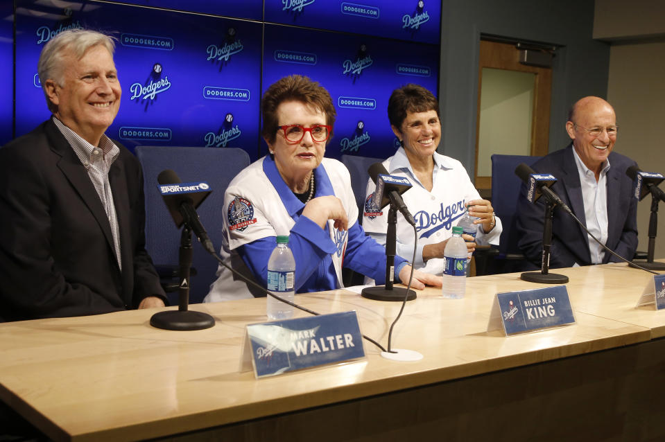 Los Angeles Dodgers owner and chairman Mark Walter, left, and Dodgers president & CEO Stan Kasten, right, introduce to the baseball team ownership group, tennis champion Billie Jean King, second from left, and her partner Ilana Kloss at a news conference in Los Angeles, Friday, Sept. 21, 2018. (AP Photo/Alex Gallardo)