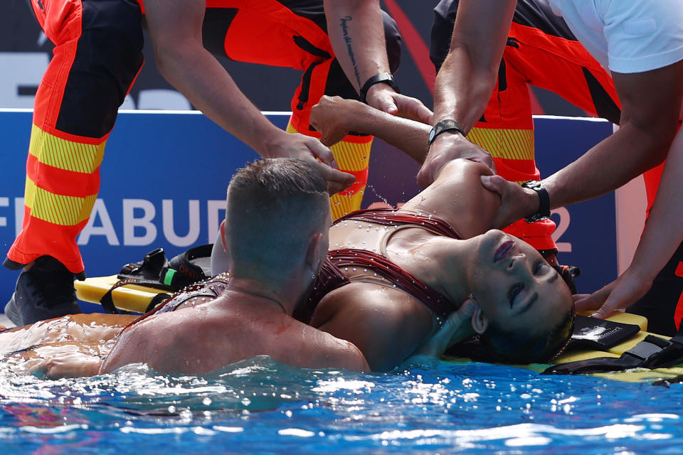 Anita Alvarez, pictured here being attended to by medical staff after fainting in the pool at the swimming world championships.