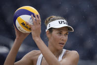 Alix Klineman, of the United States, prepares to serve during a women's beach volleyball match against the Netherlands at the 2020 Summer Olympics, Friday, July 30, 2021, in Tokyo, Japan. (AP Photo/Felipe Dana)