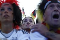 Supporters of the German national football team gather as they watch Germany's opening match against Portugal in the Euro 2012 football championships at the "Fanmeile" (Fan Mile) in Berlin on June 9, 2012. AFP PHOTO / MICHELE TANTUSSIMICHELE TANTUSSI/AFP/GettyImages