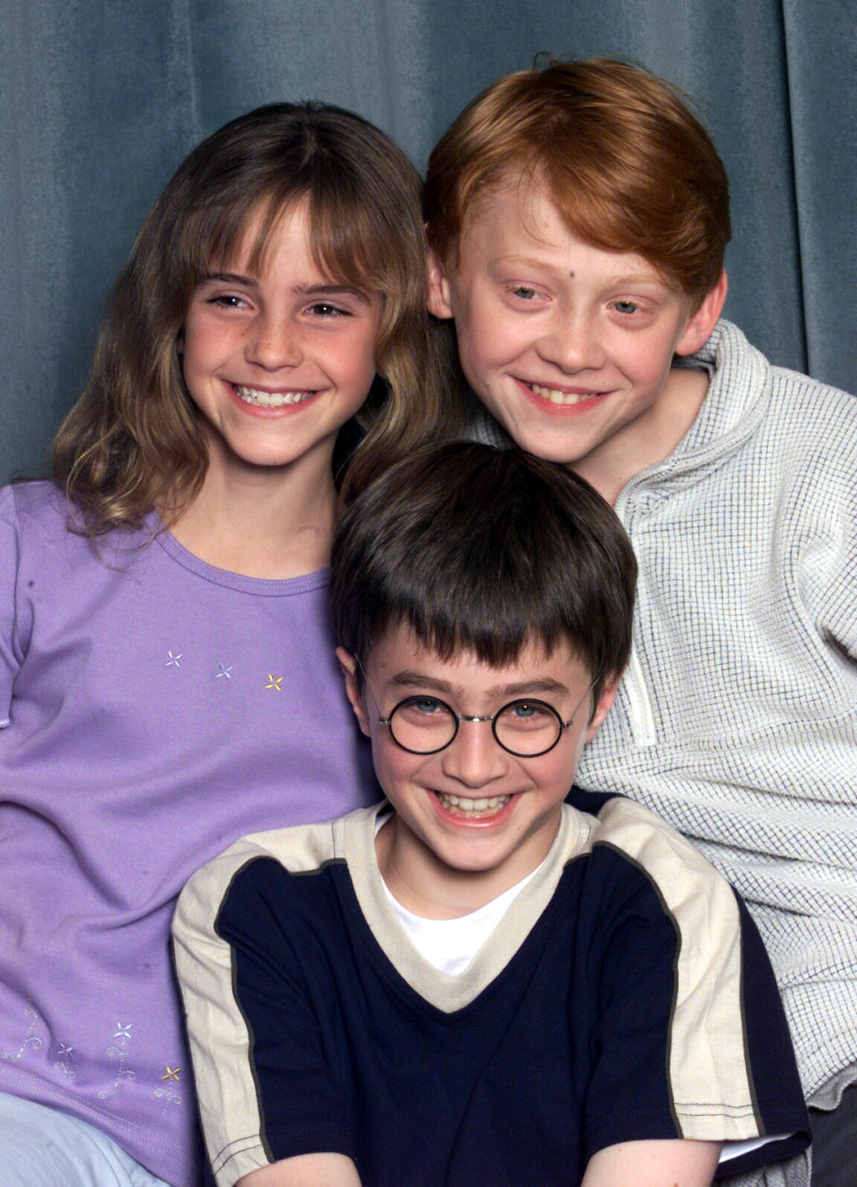 LONDON - AUGUST 23: Actors Emma Watson (L), Daniel Radcliffe (C) and Rupert Grint (R) attend a press conference for the film "Harry Potter and the Philosopher's Stone" in London on August 23, 2000. They are set to play the main characters Hermione Granger, Harry Potter and Ron Weasley in the film adaptation of the popular book by JK Rowling. (Photo by Dave Hogan/Getty Images)