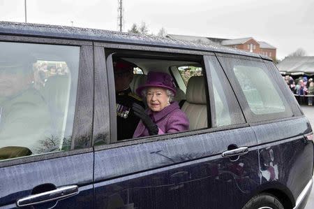 Britain's Queen Elizabeth travels in a car at Lucknow Barracks where she presented leeks to soldiers from The Royal Welsh Regiment to mark St David's Day, in Tidworth, Britain March 3, 2017. REUTERS/Ben Birchall