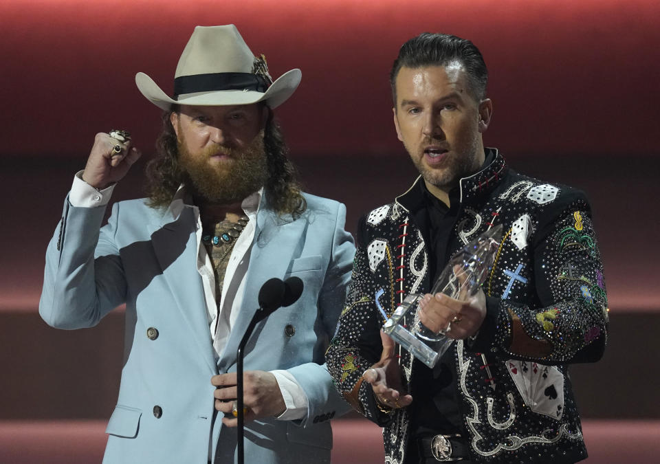 John Osborne, left, and T.J. Osborne of Brothers Osborne accept the award for vocal duo of the year at the 57th Annual CMA Awards on Wednesday, Nov. 8, 2023, at the Bridgestone Arena in Nashville, Tenn. (AP Photo/George Walker IV)