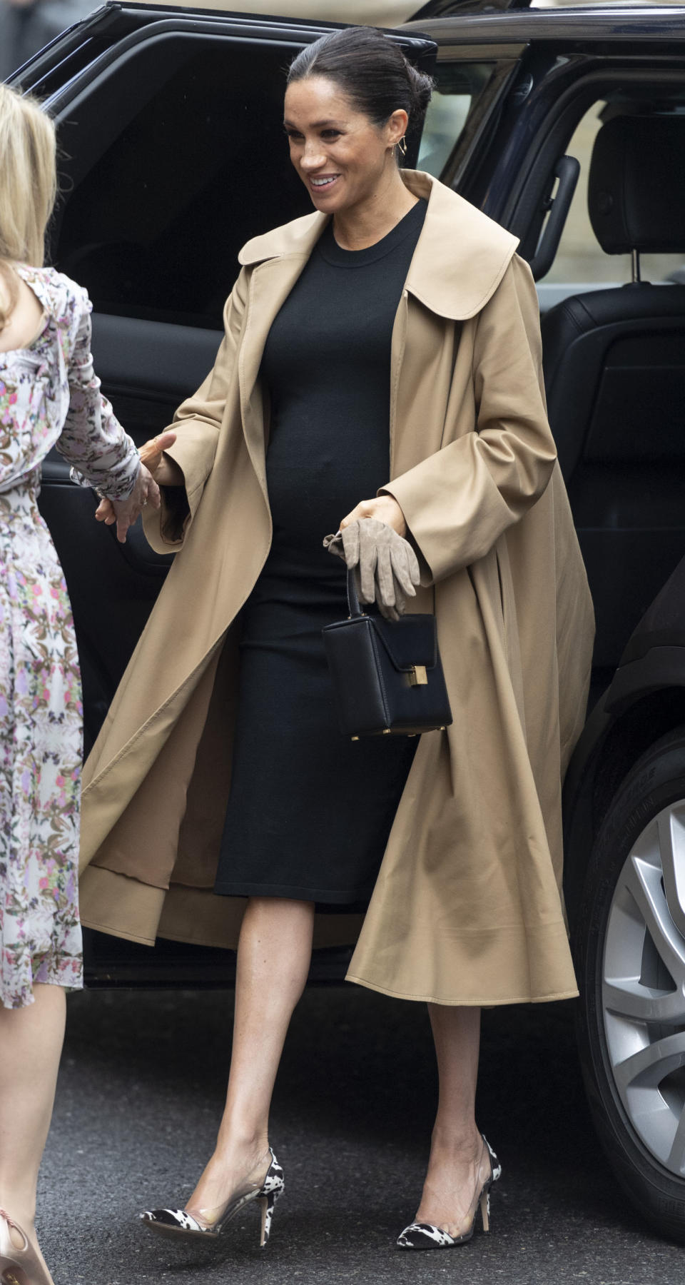 For a visit to one of her first patronages, Smart Works, the mother-to-be stepped out of her regal comfort zone in a chic £2,492 camel-hued Oscar de la Renta coat over a £170 black dress by US maternity label Hatch. But it was her bang-on-trend Gianvito Rossi cow print shoes which proved most surprising. <em>[Photo: Getty]</em>