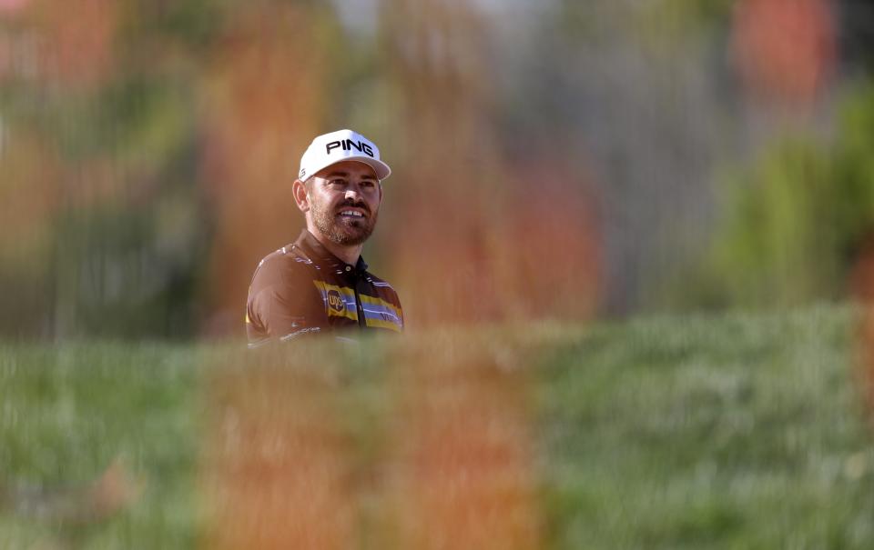 South Africa's Louis Oosthuizen follows his ball on the 14th hole during the second round of the Abu Dhabi Championship golf tournament in Abu Dhabi, United Arab Emirates, Friday, Jan. 17, 2020. (AP Photo/Kamran Jebreili)