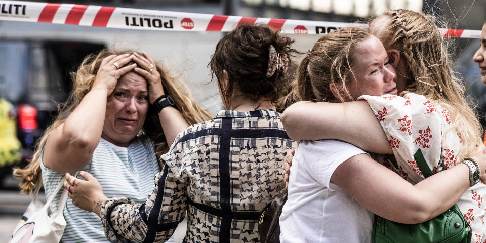 People react after the deadly shooting. (Olafur Steinar Rye Gestsson / Sipa / AP)