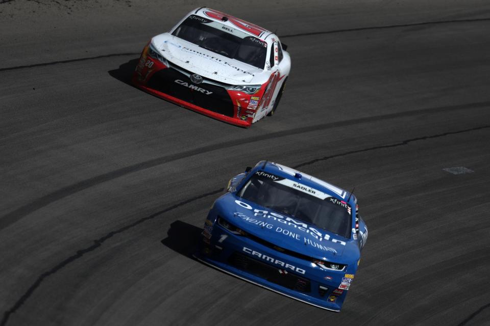 LAS VEGAS, NV – MARCH 03: Elliott Sadler, driver of the #1 OneMain Financial Chevrolet, leads Christopher Bell, driver of the #20 Rheem-Smurfit Kappa Toyota, during the NASCAR Xfinity Series Boyd Gaming 300 at Las Vegas Motor Speedway on March 3, 2018 in Las Vegas, Nevada. (Photo by Sean Gardner/Getty Images)