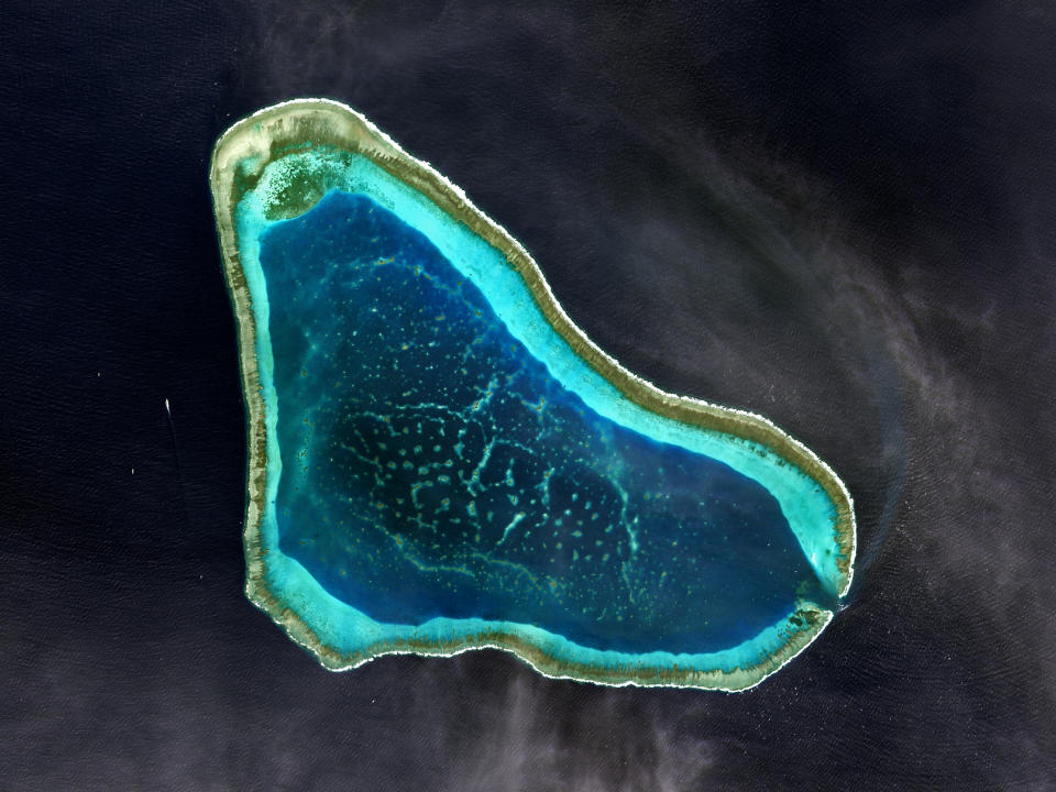 FILE PHOTO: Satellite image of Scarborough Shoal in the South China Sea, known for its rich fishing grounds on 12 January 2017. (Photo: USGS/NASA Landsat data/Orbital Horizon/Gallo Images/Getty Images)