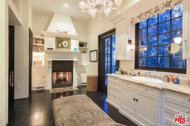 One of Akiva Goldsman's six fireplaces is in the masterbath