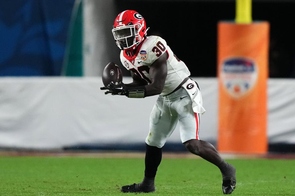 Dec 30, 2023; Miami Gardens, FL, USA; Georgia Bulldogs running back Daijun Edwards (30) rushes the ball against the Florida State Seminoles during the second half in the 2023 Orange Bowl at Hard Rock Stadium. Mandatory Credit: Jasen Vinlove-USA TODAY Sports