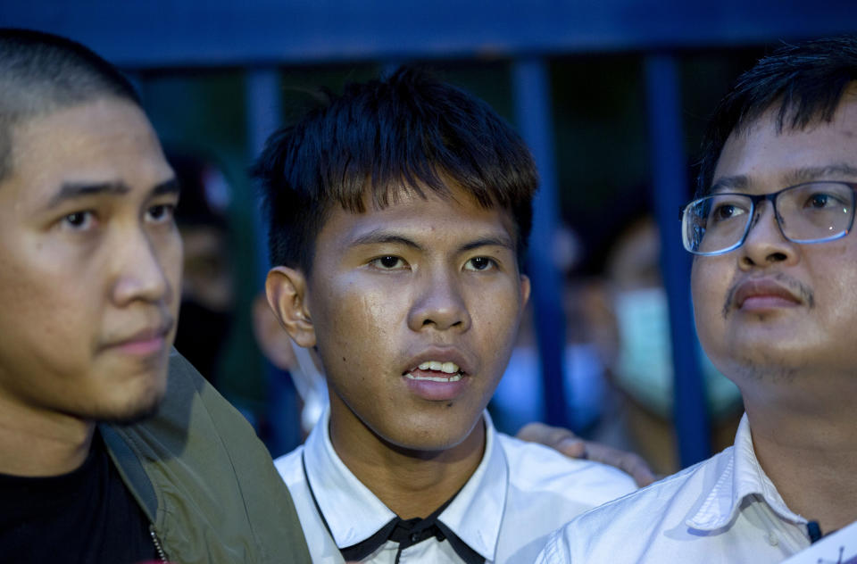 Pro-democracy activists from left, Dechathorn Bamrungmuang, Thanayuth Na Ayuthaya, and Arnon Nampha leave the criminal courthouse in Bangkok, Thailand, Thursday, Aug. 20, 2020. Thai police arrested nine pro-democracy activists, including two rappers, in a crackdown on growing protests that have emerged as the most serious threat to the government led by a former army general they accuse of incompetence and corruption. Thai criminal court released all nine of them on bail. (AP Photo/Gemunu Amarasinghe)