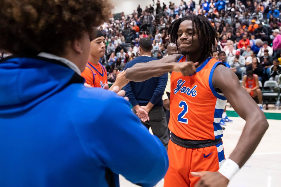 York High's Juelz Tucker (2) is introduced in the starting lineup before the YAIAA boys' basketball championship game against Central York at the York Tech Field House Feb. 16, 2023, in York Township.