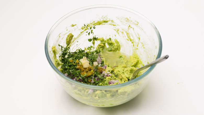 preparing guacamole mixture