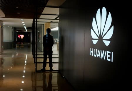 FILE PHOTO: A Huawei company logo is seen at a shopping mall in Shanghai