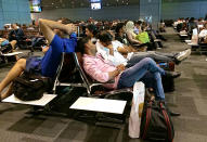 <p>Passengers of cancelled flights wait in Hamad International Airport (HIA) in Doha, Qatar, Tuesday, June 6, 2017. (AP Photo/Hadi Mizban) </p>