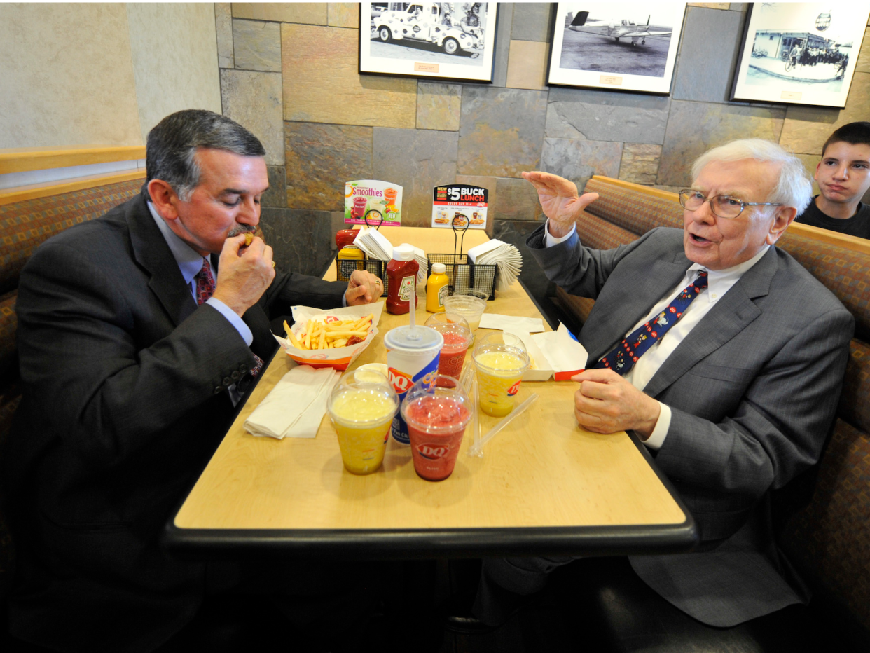 Warren Buffett eating lunch with John Gainor, then Dairy Queen’s CEO, in 2013 in Omaha, Nebraska. The charity lunch will be much fancier than this. (AP)