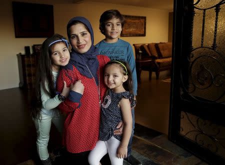 Mirvette Judeh poses with her children, Ayah Maaytah (L-R), 7, Salma Maaytah, 3, and Rakan Maaytah, 9, at their home in Buena Park, California December 17, 2015. REUTERS/Jason Redmond