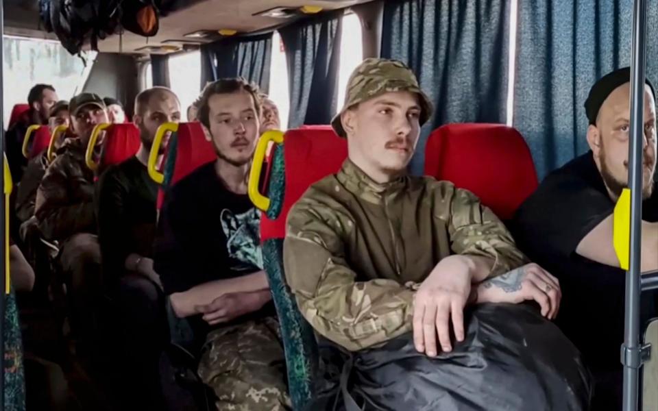 Ukrainian servicemen wait on a bus as they are evacuated from the Azovstal steel plant - RUSSIAN DEFENCE MINISTRY PRESS SERVICE HANDOUT/EPA-EFE/Shutterstock