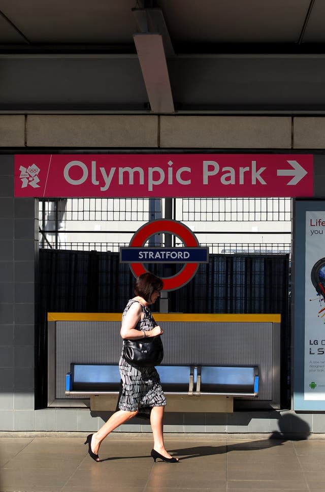 A visitor makes her way from Stratford station to the Olympic Park