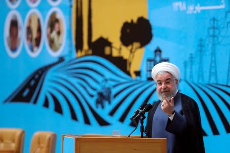 Iranian President Hassan Rouhani gestures as he delivers a speech during the Conference of Government’s Achievements in Developing Rural Infrastructure in Tehran