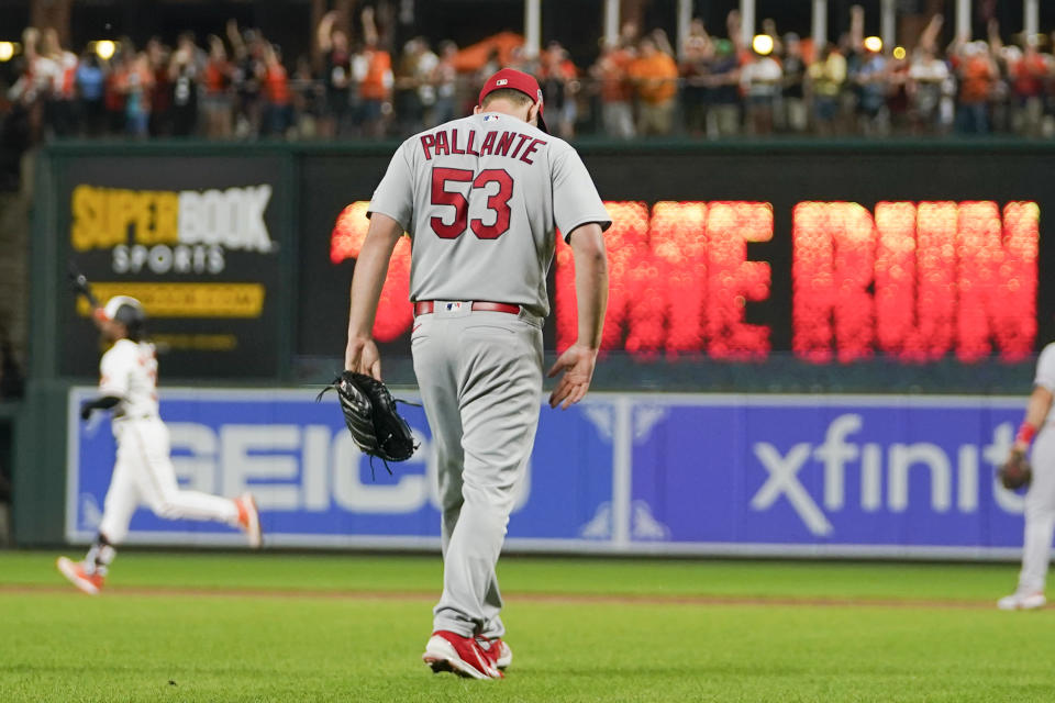 St. Louis Cardinals relief pitcher Andre Pallante (53) reacts as Baltimore Orioles' Cedric Mullins, left, runs the bases after hitting a grand slam off him in the fifth inning of a baseball game, Monday, Sept. 11, 2023 in Baltimore. Orioles' Gunnar Henderson, Ryan O'Hearn and Ryan Mountcastle scored on the grand slam. (AP Photo/Julio Cortez)