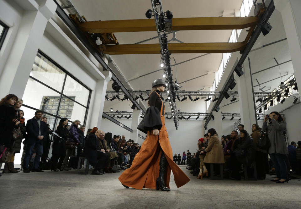 A model wears a creation for Mila Schon women's Fall-Winter 2013-14 collection, part of the Milan Fashion Week, unveiled in Milan, Italy, Wednesday, Feb. 20, 2013. (AP Photo/Luca Bruno)