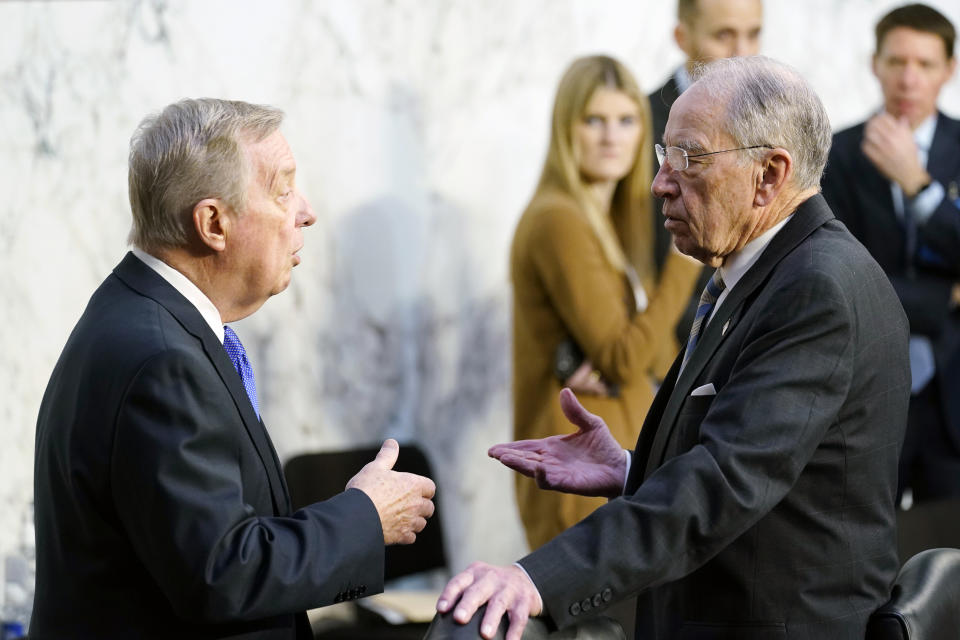 Senate Judiciary Committee Chairman Sen. Dick Durbin, D-Ill., left, speaks with ranking member Sen. Chuck Grassley, R-Iowa, right, before the start of the confirmation hearing for Supreme Court nominee Judge Ketanji Brown Jackson on Capitol Hill in Washington, Wednesday, March 23, 2022. (AP Photo/Susan Walsh)