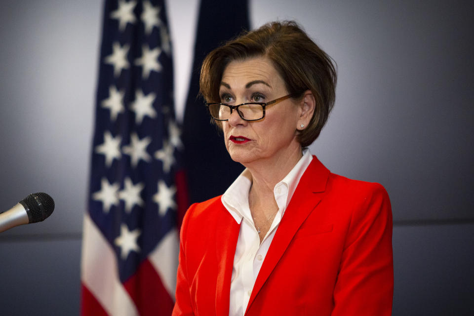 FILE - Iowa Governor Kim Reynolds holds a news conference on COVID-19 in Johnston, Iowa, Tuesday, May 19, 2020. As the federal government scrambles to crack down on surging child labor violations, some state lawmakers want to let children work longer hours and in more hazardous occupations. In addition to allowing 16- and 17-year-olds to work unsupervised in child care centers last year, the Iowa Legislature sent a bill to Republican Gov. Reynolds earlier this month to expand the hours minors can work and allow 16- and 17-year-olds to serve alcohol in restaurants. (Olivia Sun/The Des Moines Register via AP, Pool, File)