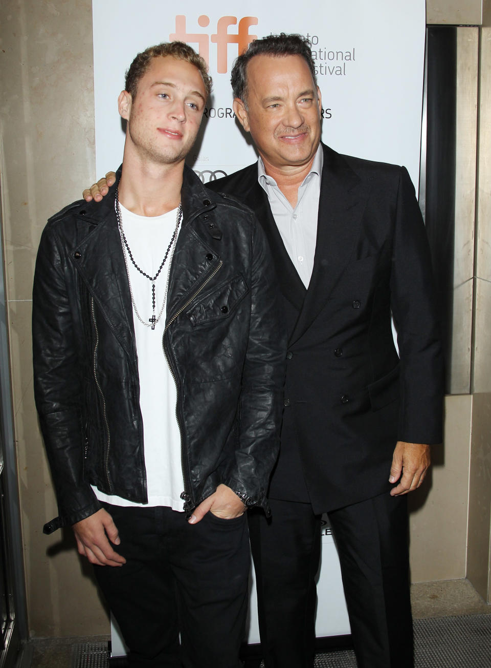 TORONTO, ON - SEPTEMBER 08:  Tom Hanks (R) and his son Chet Hanks arrive at "Cloud Atlas" premiere during the 2012 Toronto International Film Festival held at Princess of Wales Theatre on September 8, 2012 in Toronto, Canada.  (Photo by Michael Tran/FilmMagic)