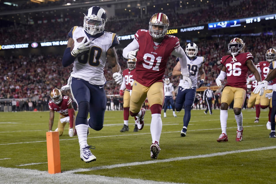 Los Angeles Rams running back Todd Gurley II (30) runs for a touchdown against the San Francisco 49ers during the first half of an NFL football game in Santa Clara, Calif., Saturday, Dec. 21, 2019. (AP Photo/Tony Avelar)