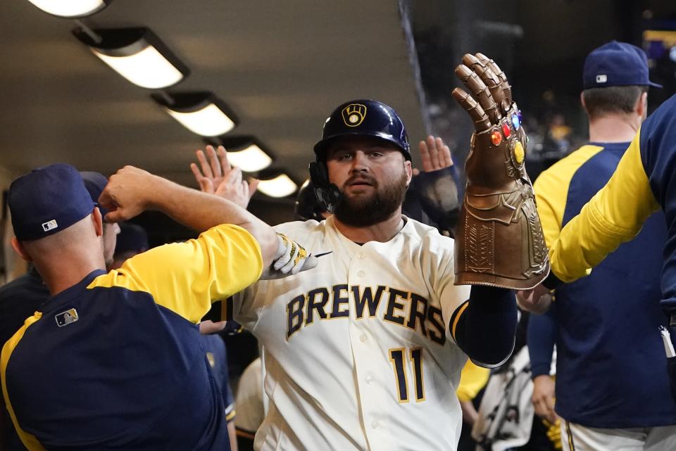 Milwaukee Brewers' Rowdy Tellez celebrates after hitting a two-run home run during the first inning of a baseball game against the Chicago Cubs Tuesday, July 5, 2022, in Milwaukee. (AP Photo/Morry Gash)