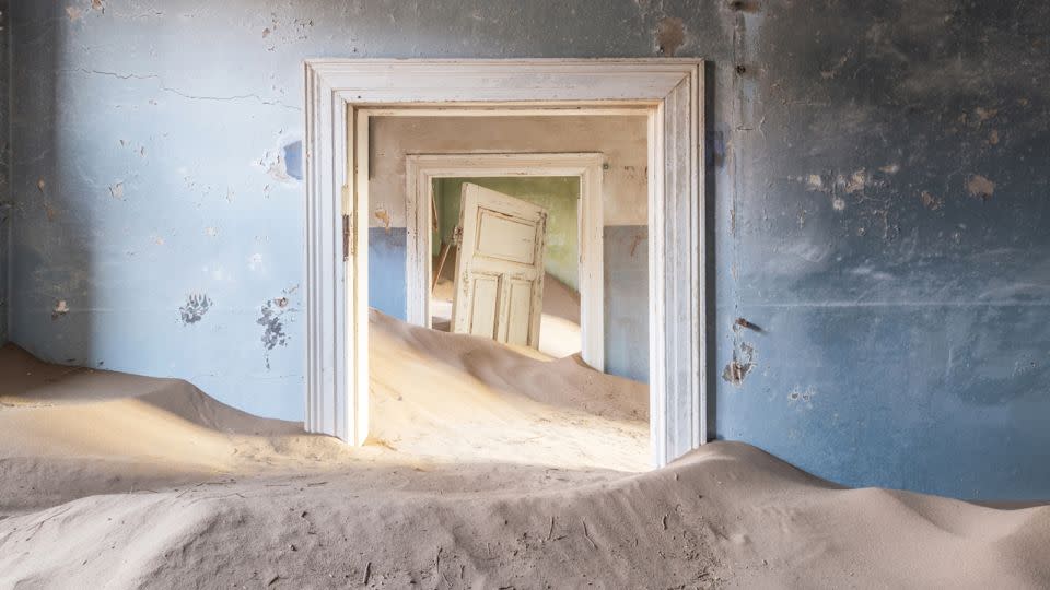 An image of abandoned Namibian ghost town Kolmanskop by photographer Romain Veillon. - Romain Veillon