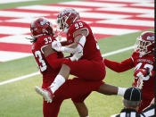 Fresno State defensive end Kwami Jones celebrates his sack against Hawaii with teammate Colby Warkentin during the first half of an NCAA college football game in Fresno, Calif., Saturday, Oct. 24, 2020. (AP Photo/Gary Kazanjian)